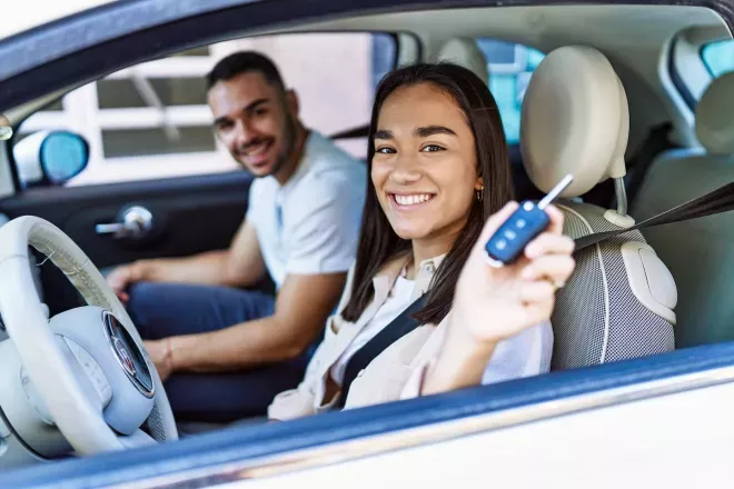 Couple driving new car Couple driving new car