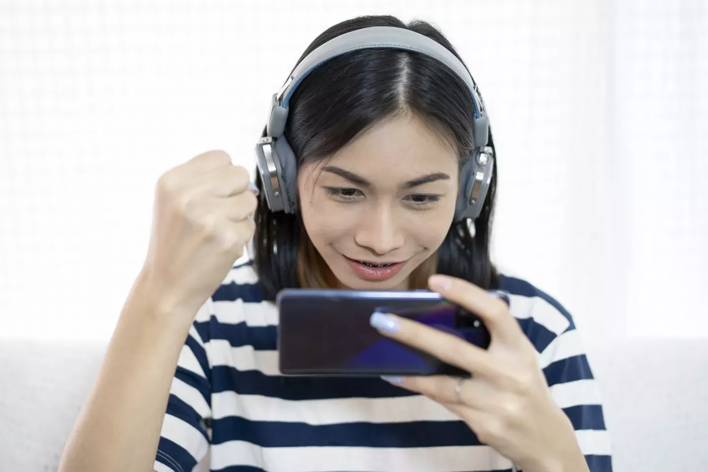 woman on phone with headphones on woman on phone with headphones on
