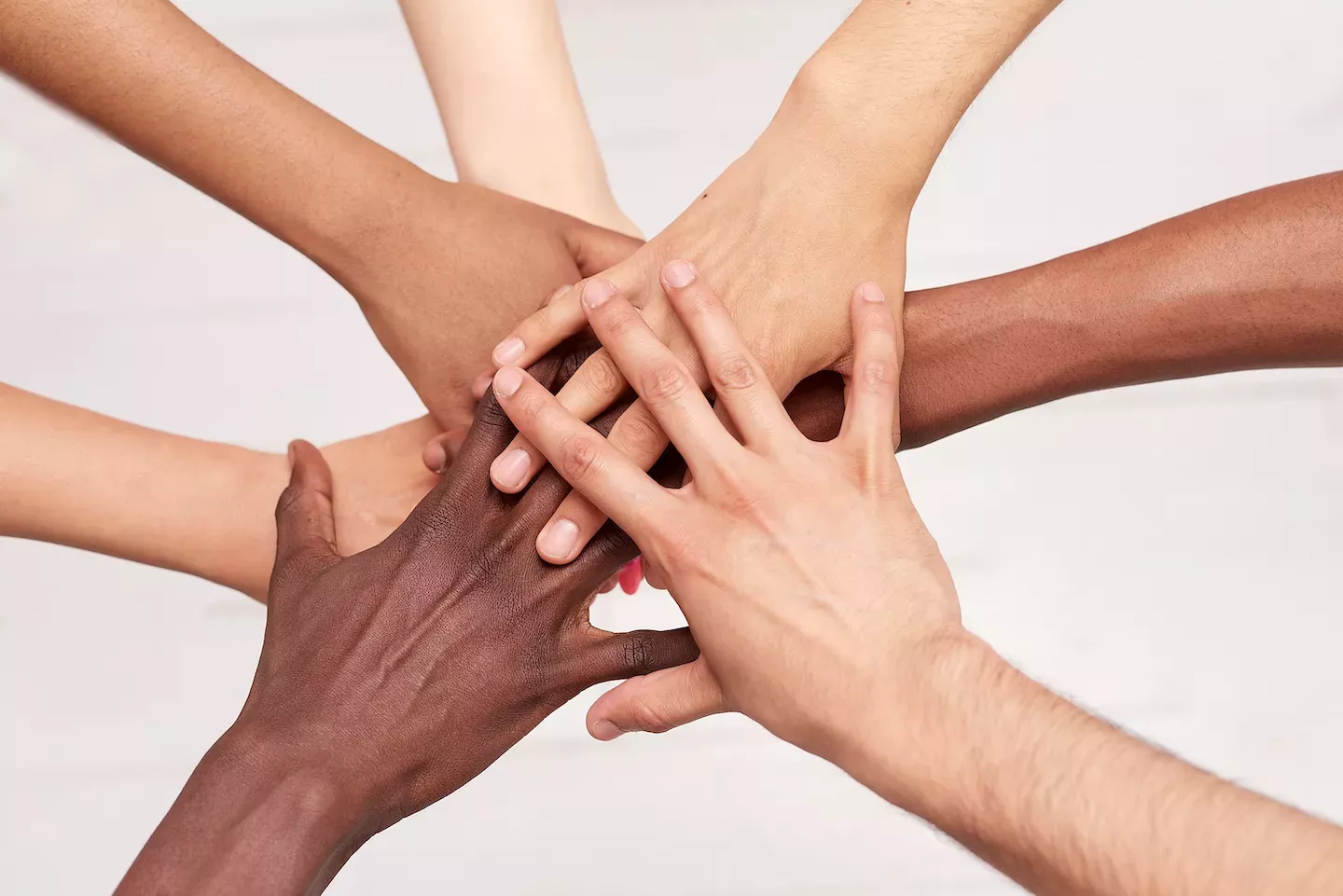 Hands stacked Hands stacked