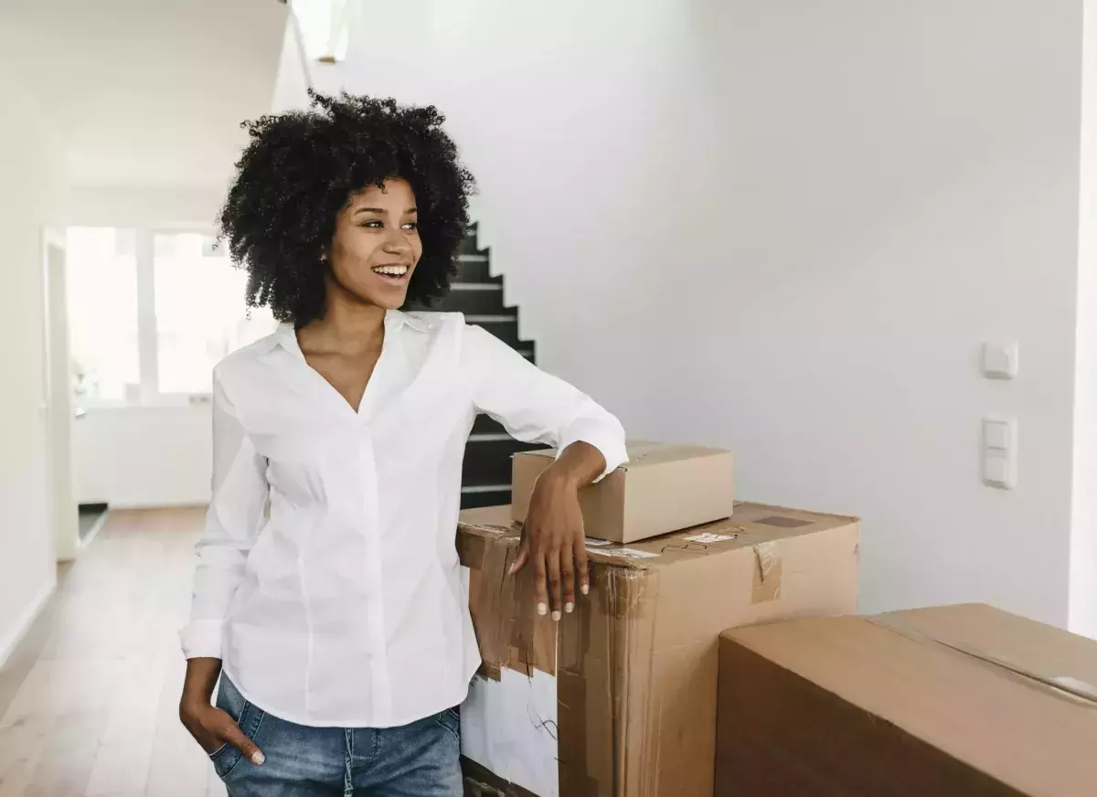 Woman moving into a new home Woman moving into a new home