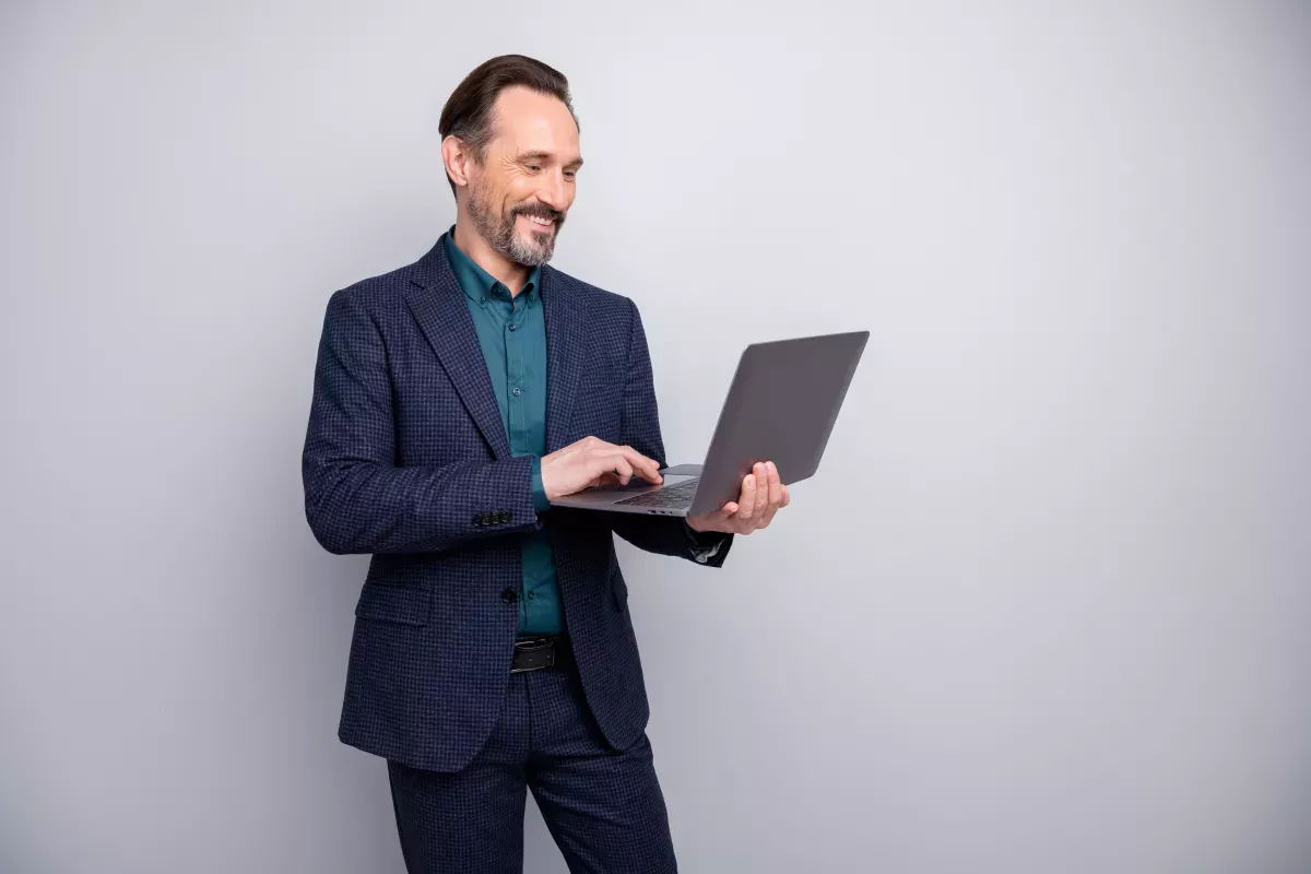 Man holding laptop Man holding laptop