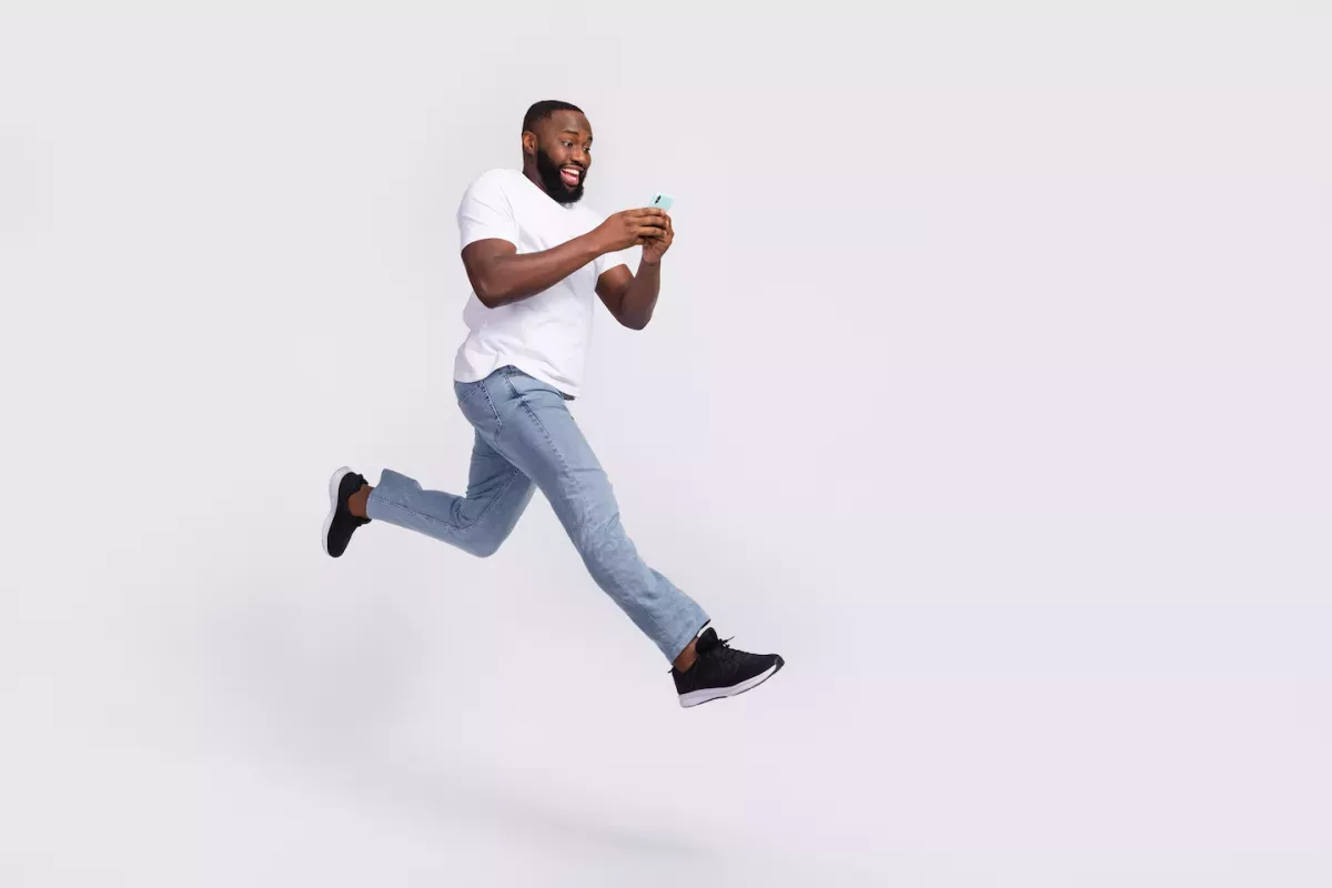 Man jumping with phone Man jumping with phone
