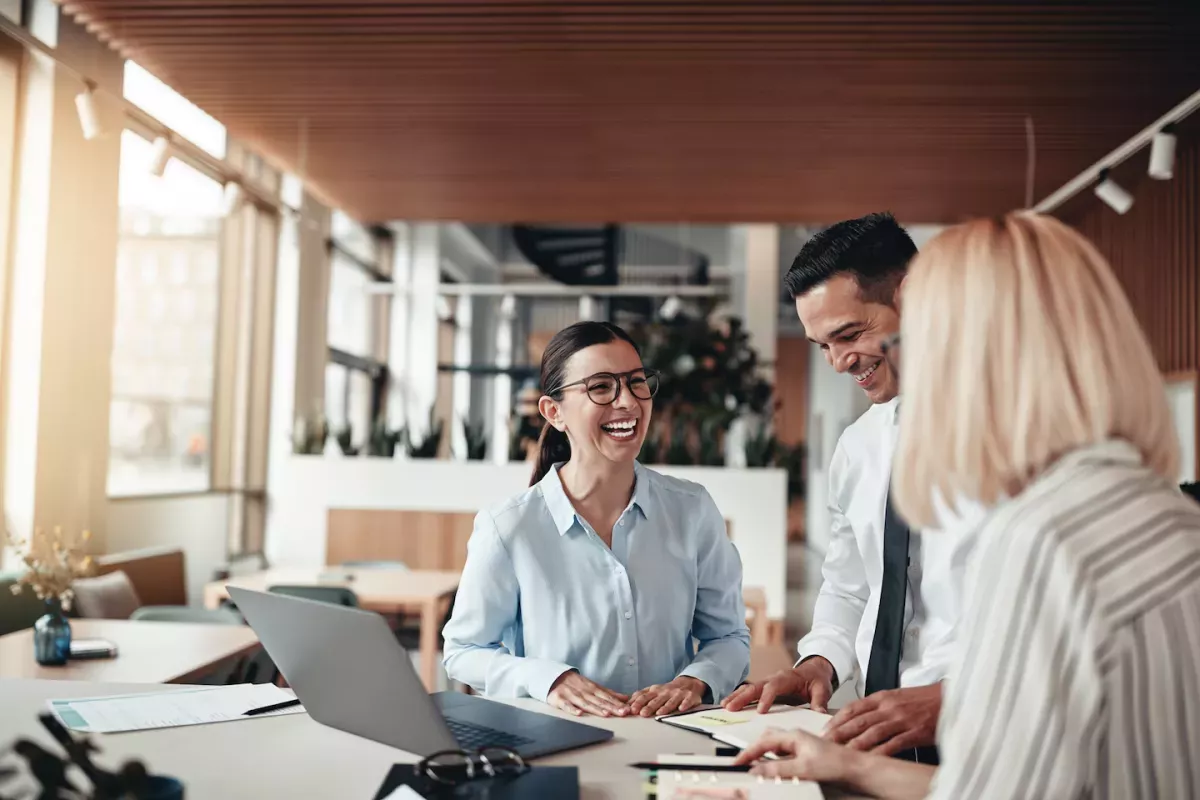 Happy colleagues working in an office Happy colleagues working in an office