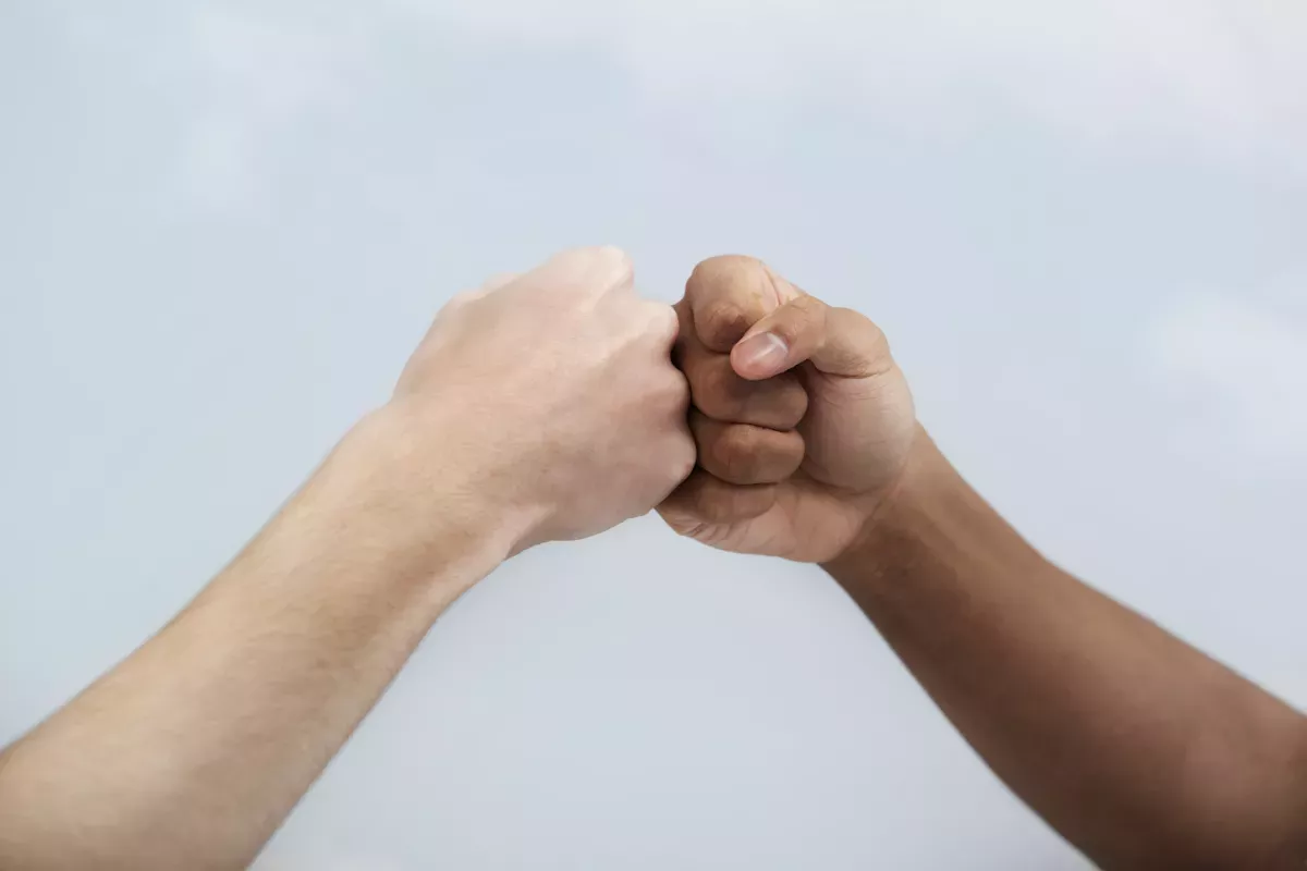 Two hands giving a fist bump Two hands giving a fist bump