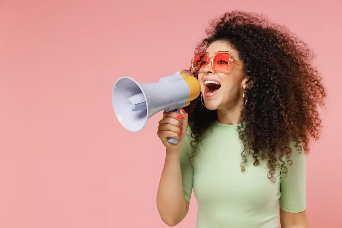 woman holding megaphone woman holding megaphone