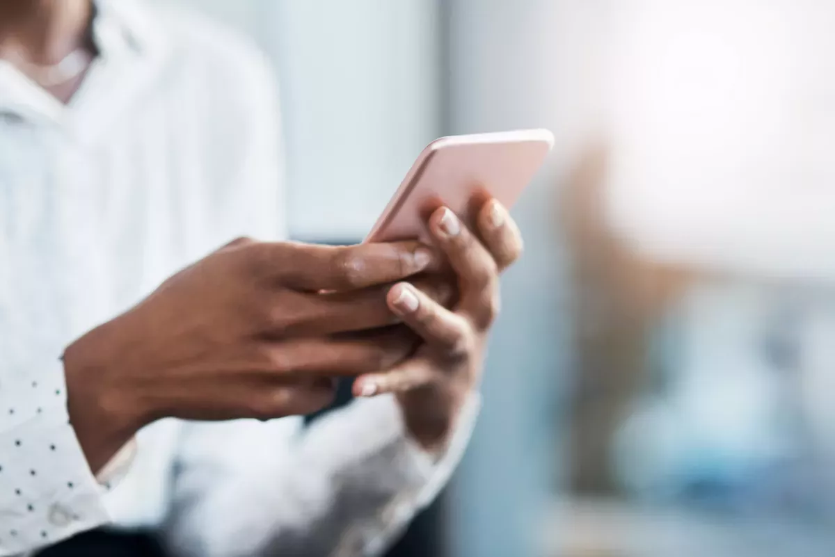 two hands holding a cellphone two hands holding a cellphone