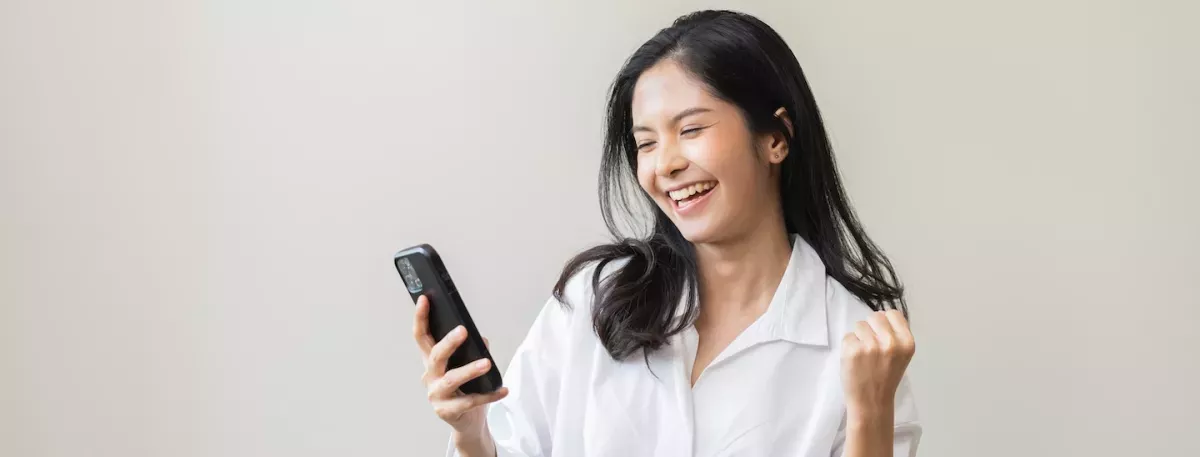 woman looking at cell phone woman looking at cell phone