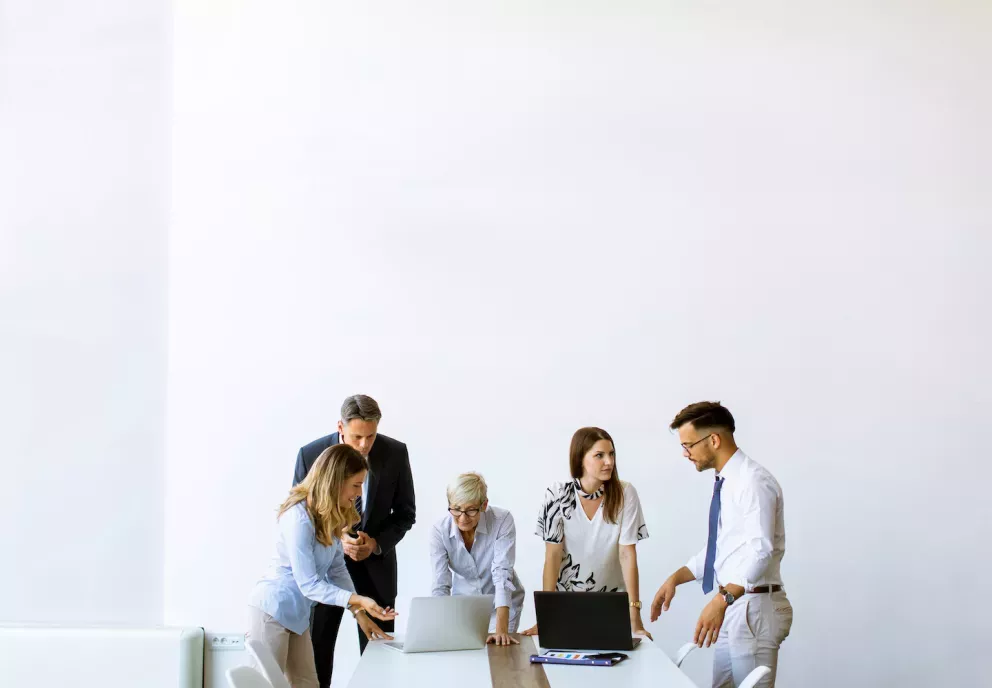 Team of people working together in an office Team of people working together in an office