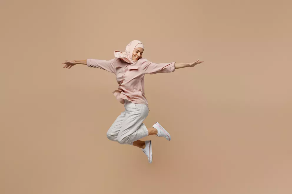 woman leaping with joy woman leaping with joy