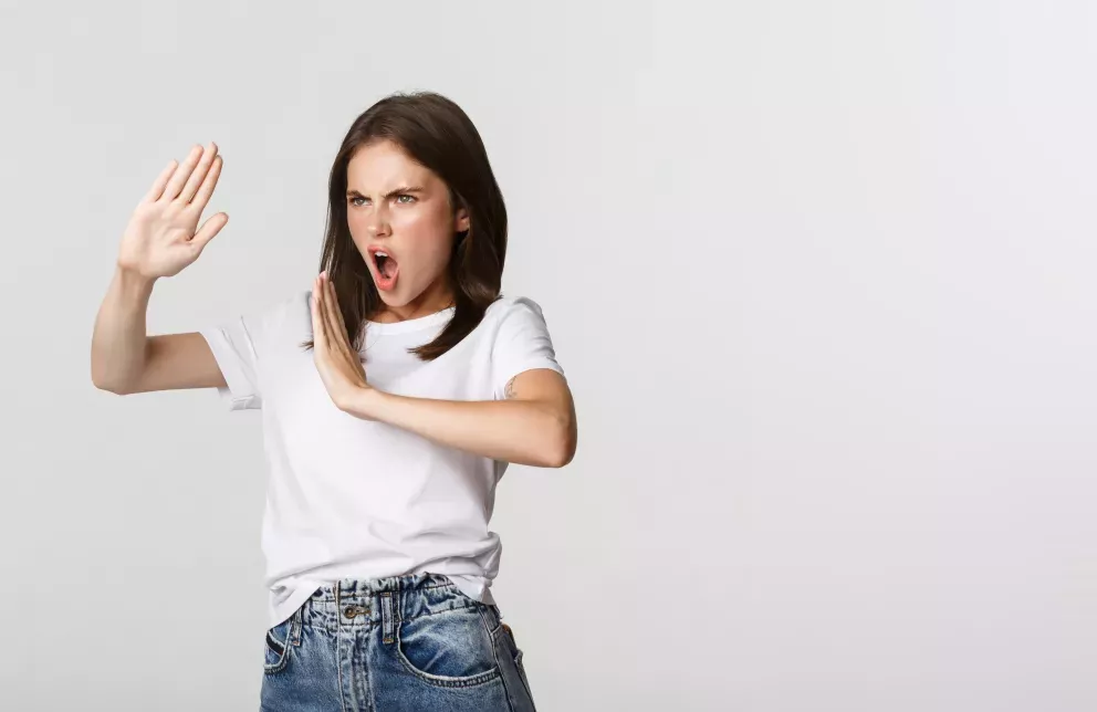 woman holding hands up in karate pose woman holding hands up in karate pose