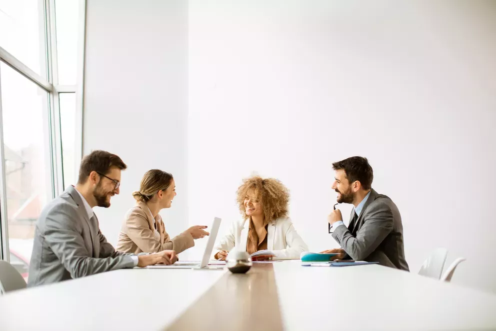 happy coworkers in conference room happy coworkers in conference room