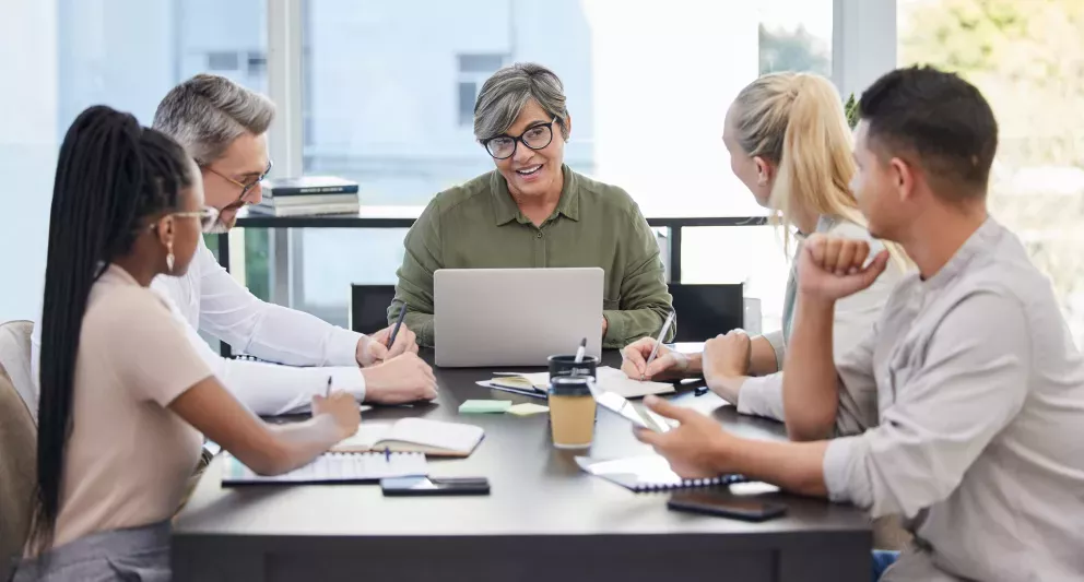 Colleagues in a meeting working together Colleagues in a meeting working together