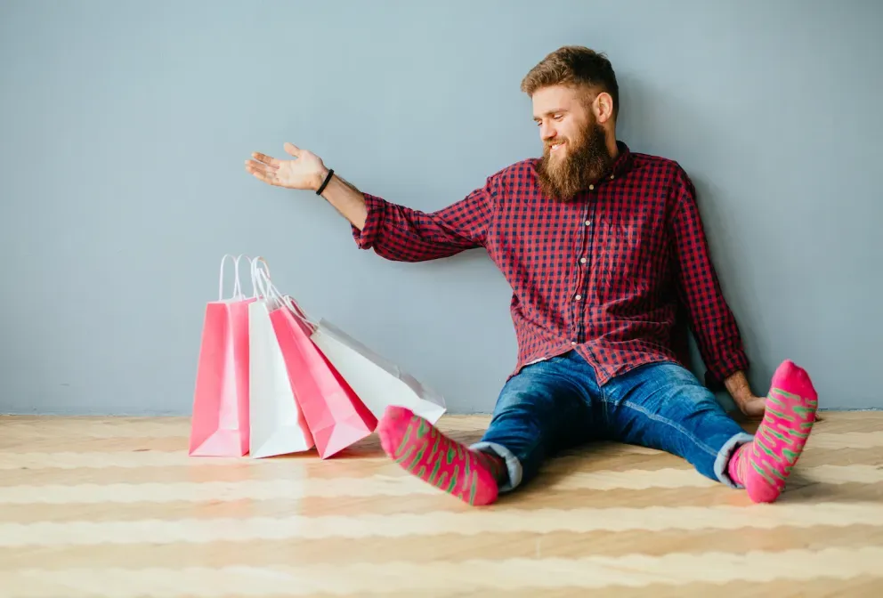 man in socks sitting with shopping bags man in socks sitting with shopping bags