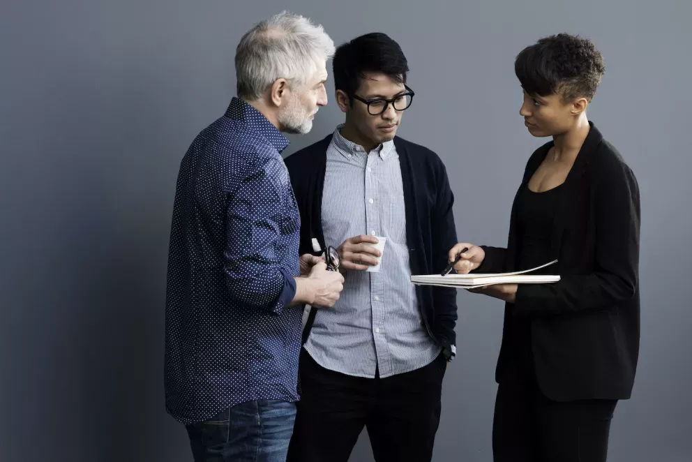 Team discussing business in a huddle Team discussing business in a huddle