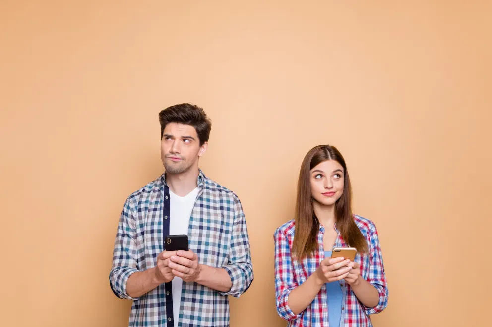 concerned people holding cell phones concerned people holding cell phones