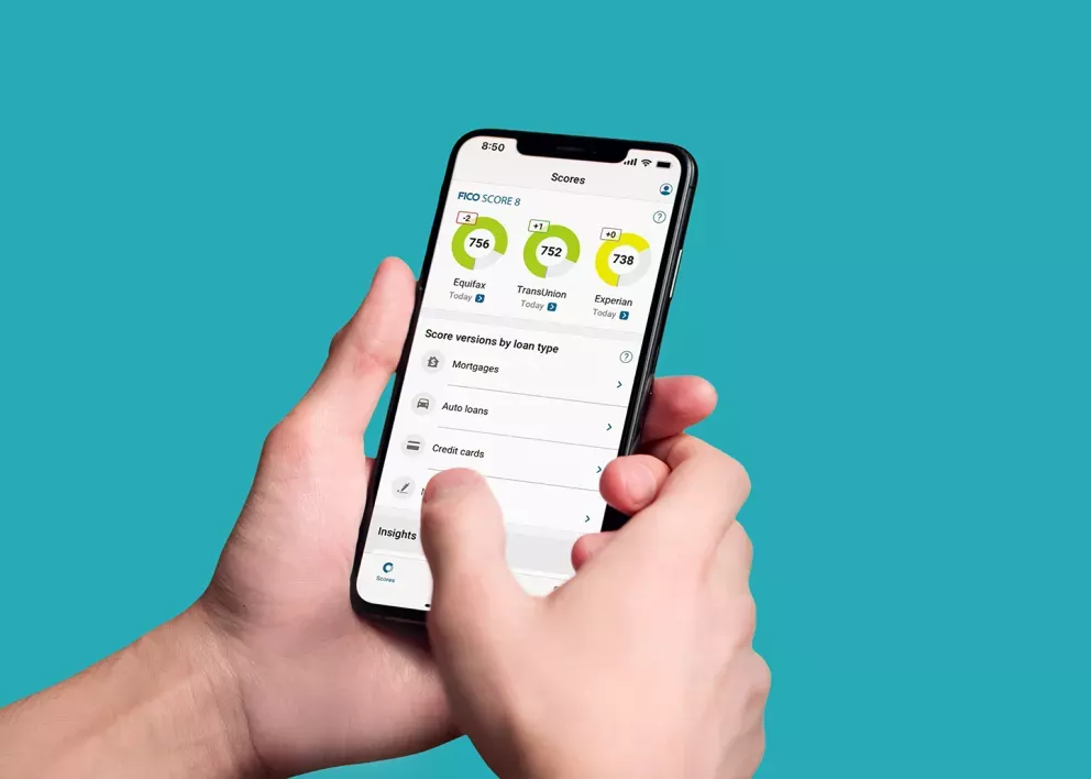 Person checking their FICO Score on a mobile phone Person checking their FICO Score on a mobile phone