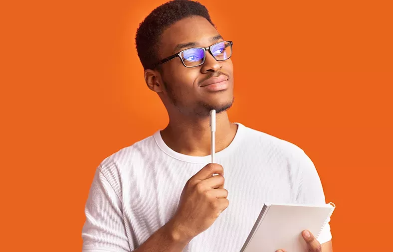 man holding pen and notebook man holding pen and notebook