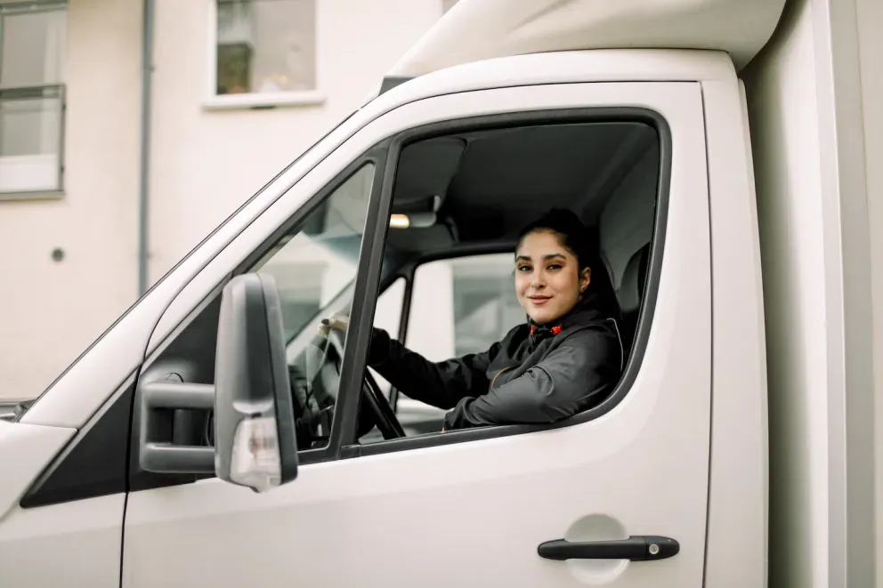 Woman driving a delivery van Woman driving a delivery van