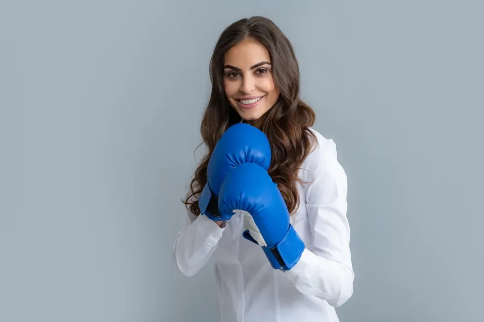 smiling woman with boxing gloves on smiling woman with boxing gloves on