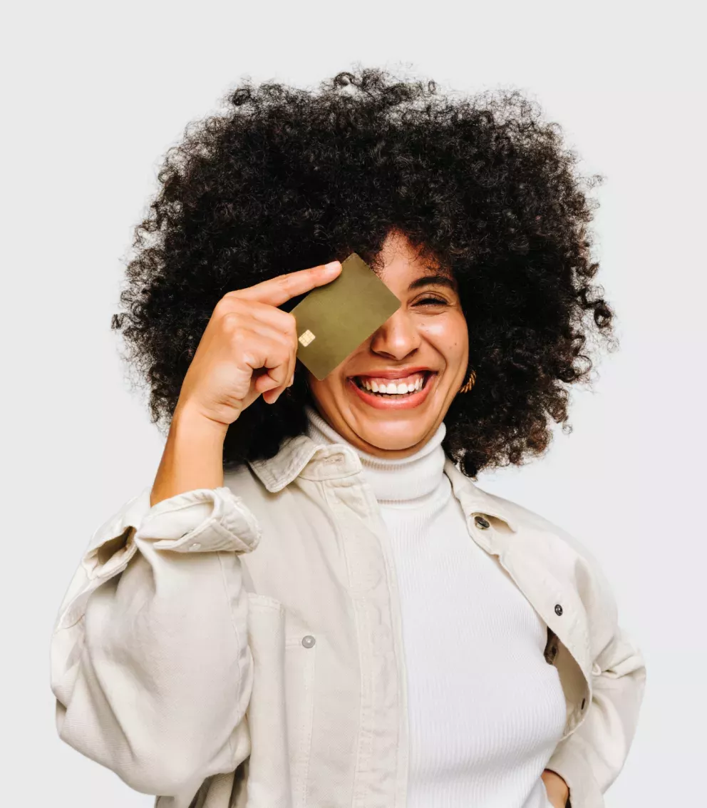 woman holding credit card over eye woman holding credit card over eye