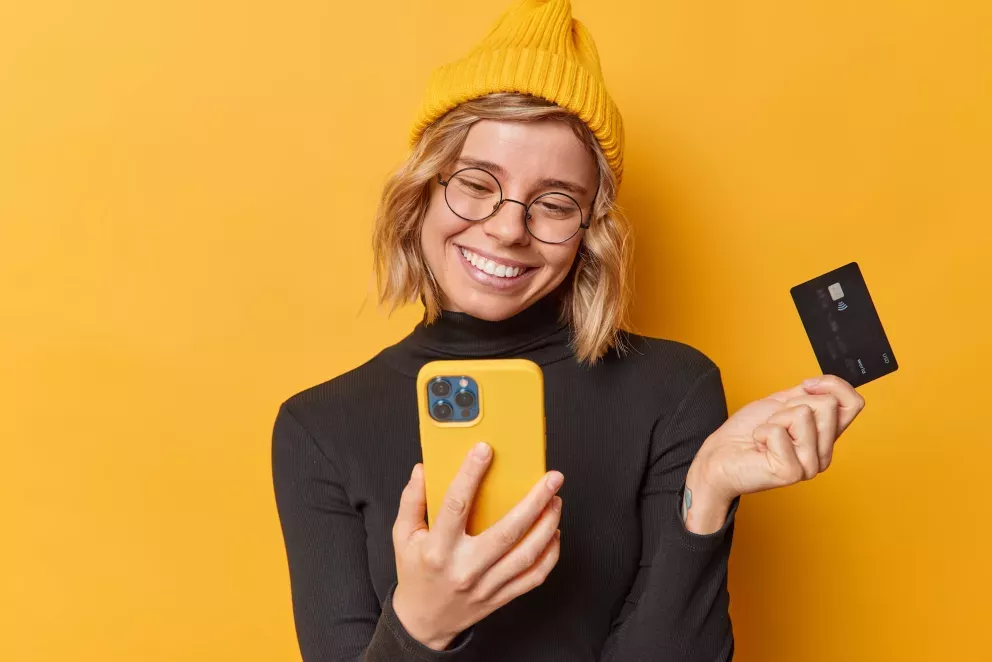 Woman with phone and card Woman with phone and card