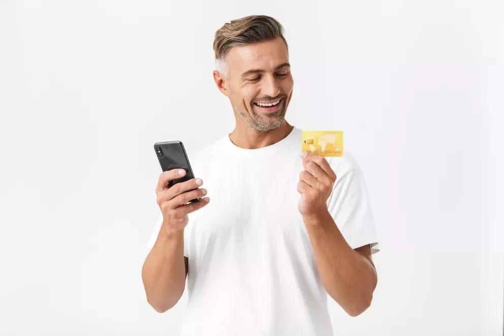 Man with phone and card Man with phone and card