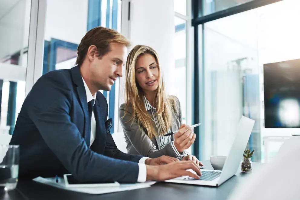 Business man and woman on laptop Business man and woman on laptop