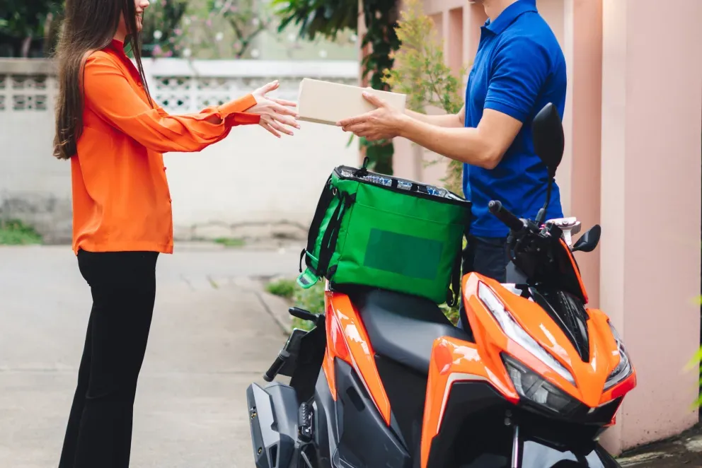 Delivery man with motorcycle and package Delivery man with motorcycle and package