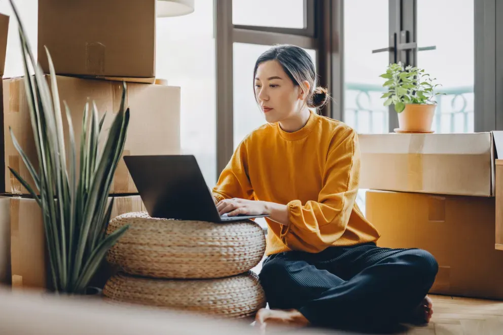 Woman sitting on floor and typing on laptop. Woman sitting on floor and typing on laptop.