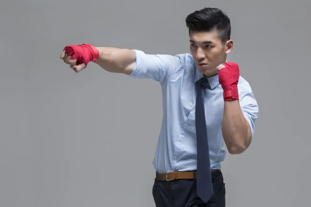 business man throwing a punch business man throwing a punch