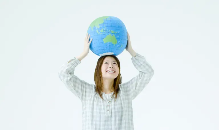 Woman holding world on top of her head Woman holding world on top of her head