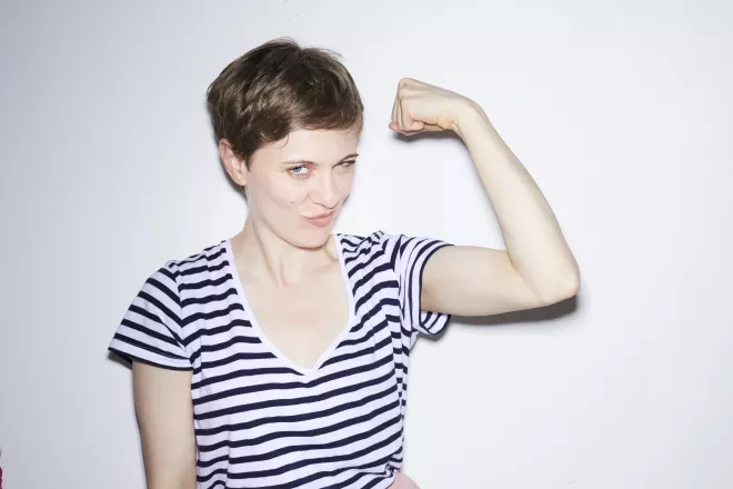 smiling woman flexing smiling woman flexing