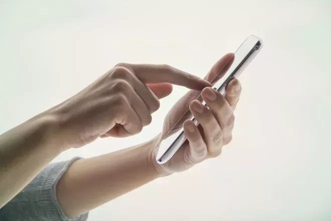 close up of person using cell phone close up of person using cell phone
