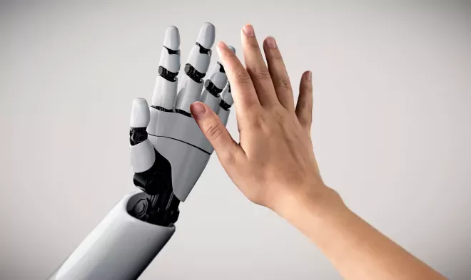 Human and robot giving a high five Human and robot giving a high five