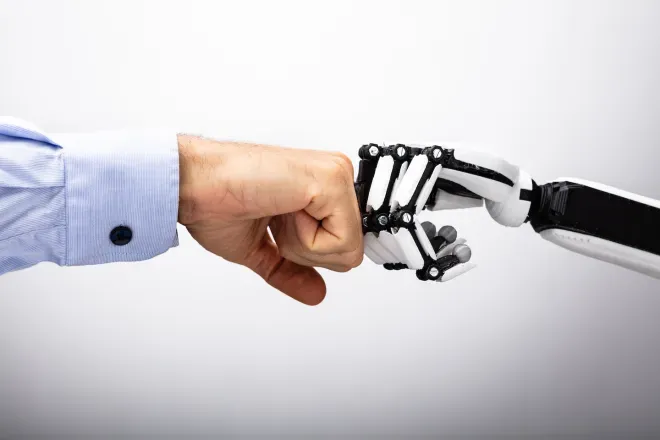 human hand and robot hand bumping fists human hand and robot hand bumping fists