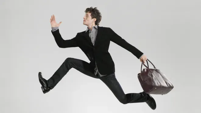 Business man leaping effortlessly Business man leaping effortlessly