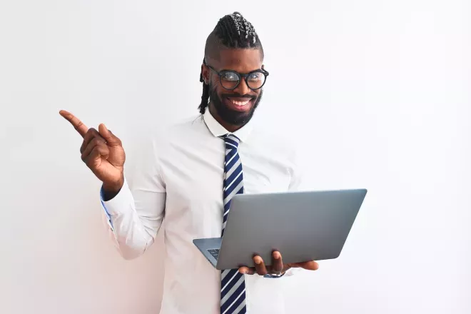 smiling business man holding laptop smiling business man holding laptop