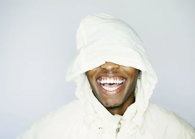 person with sweatshirt hood over face person with sweatshirt hood over face