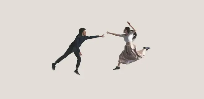 two people extending arms to each other two people extending arms to each other