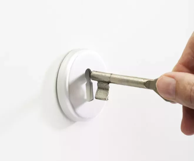 putting key into key hole putting key into key hole