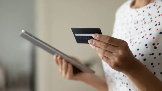 Woman with phone and card Woman with phone and card