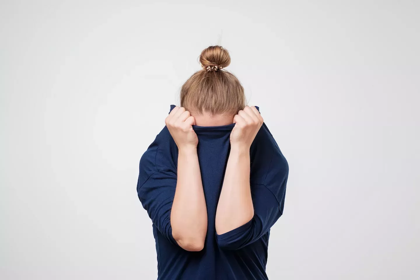 Person hiding in their sweater Person hiding in their sweater