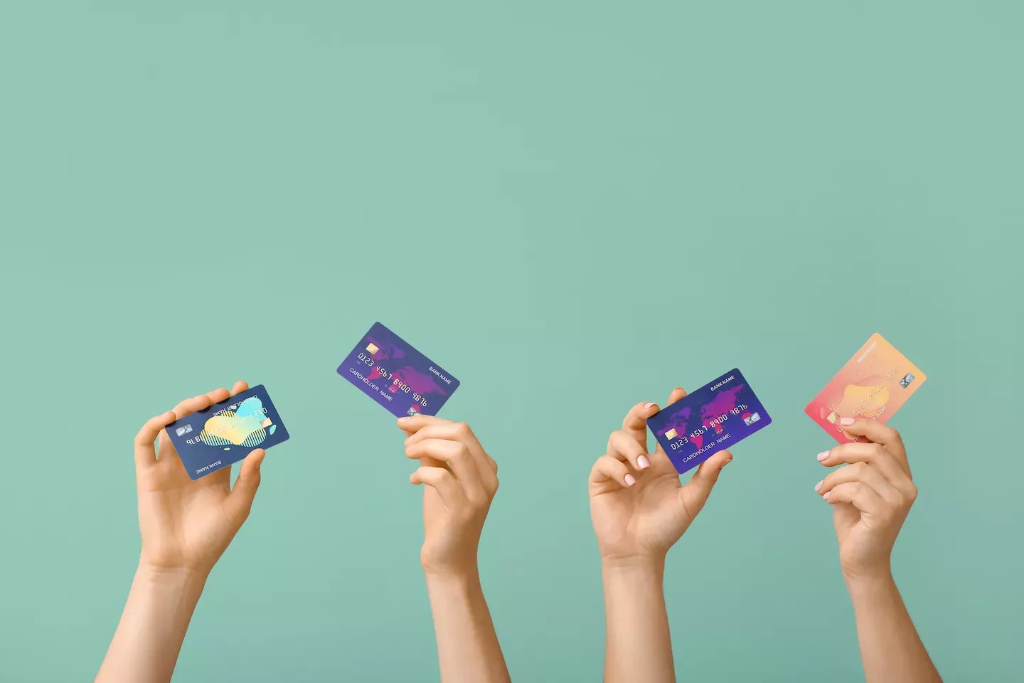 Hands holding credit cards Hands holding credit cards