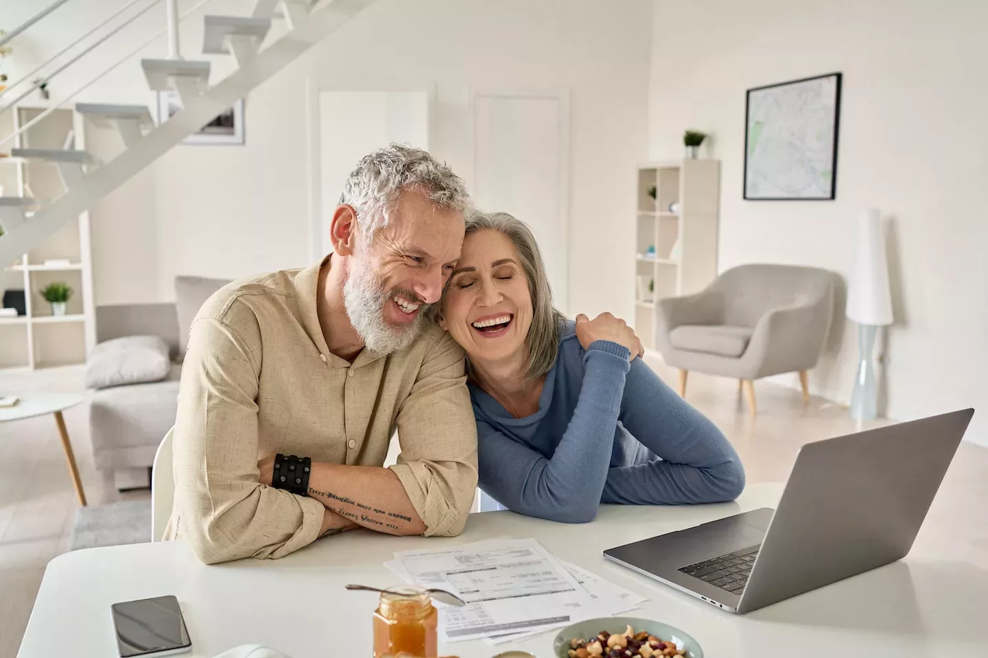 Couple paying their mortgage Couple paying their mortgage