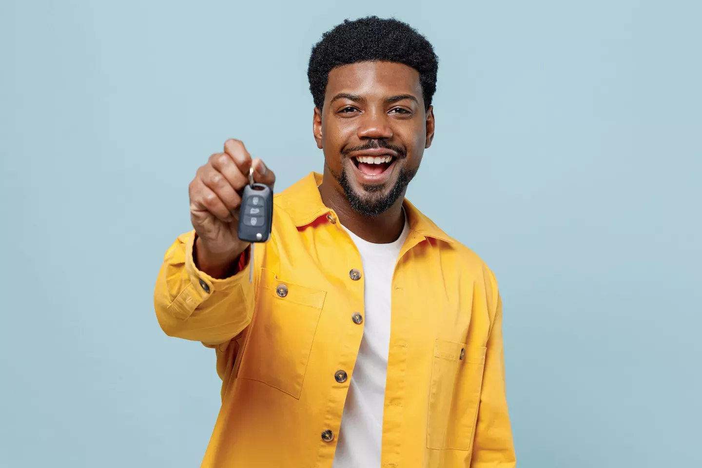 Man holding a set of car keys Man holding a set of car keys