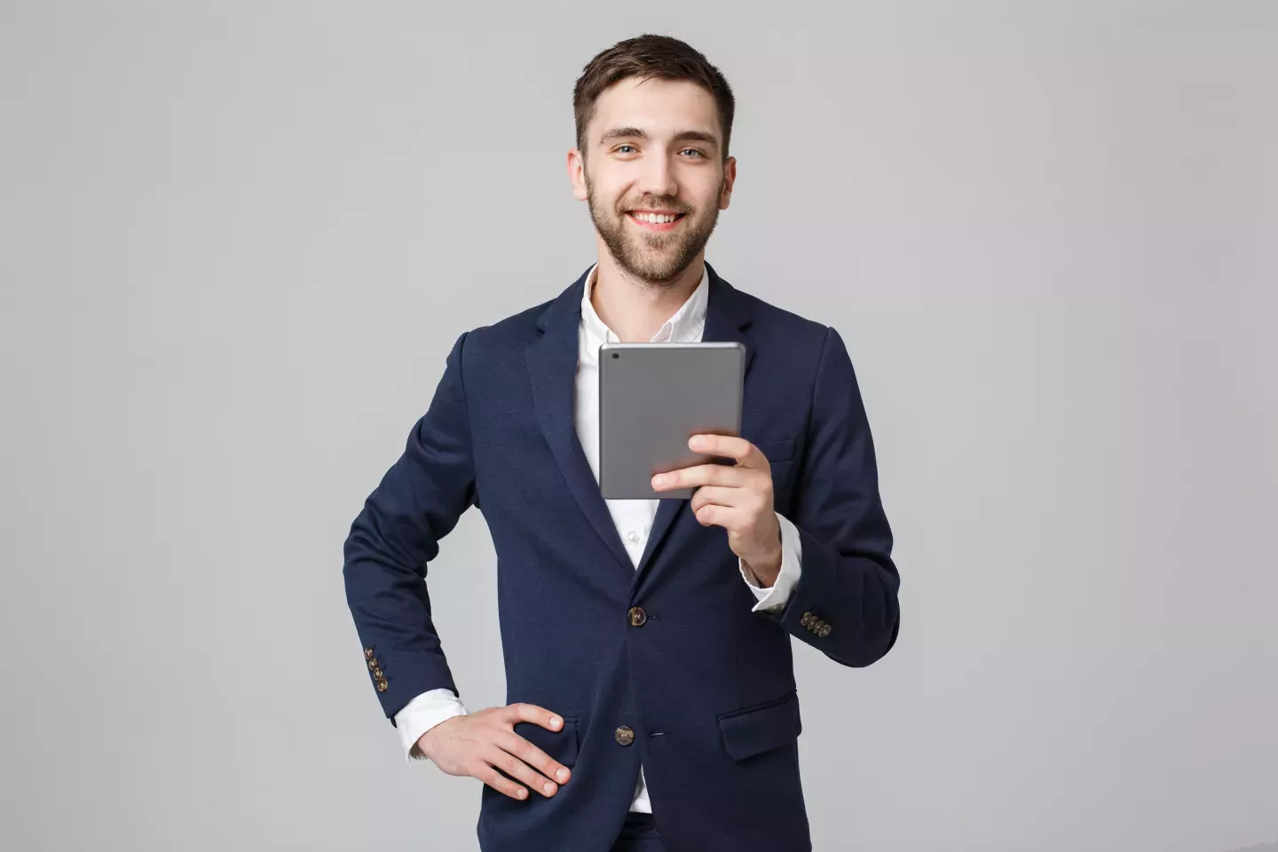 smiling business man holding tablet smiling business man holding tablet