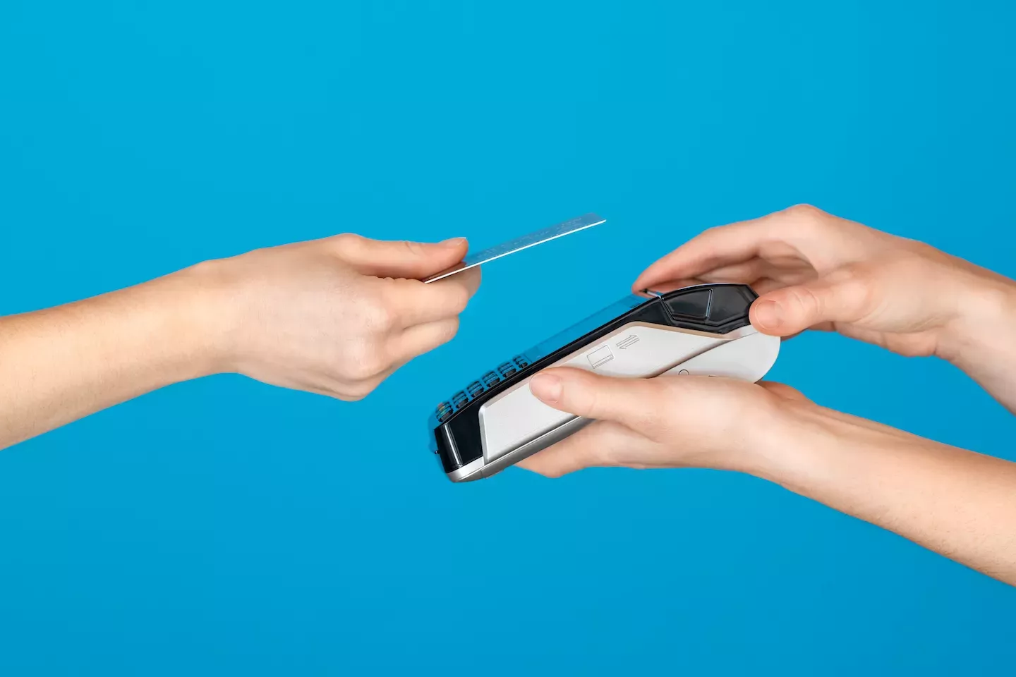 Person paying with a credit card Person paying with a credit card