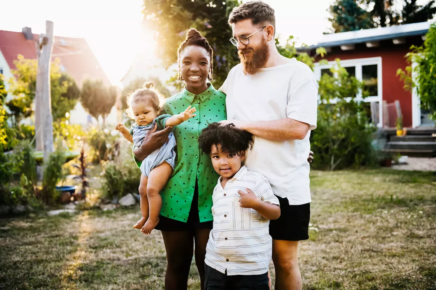Family in front of their home Family in front of their home