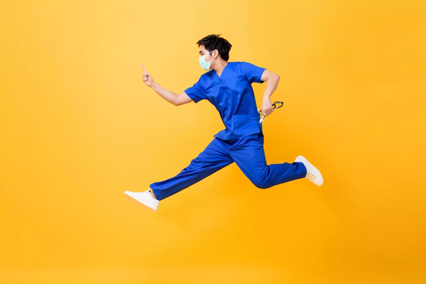 Doctor with mask jumping in the air Doctor with mask jumping in the air