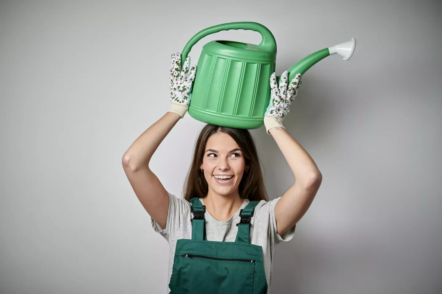 woman with watering can woman with watering can